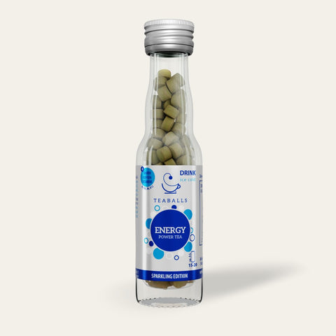 TEABALLS Energy - Dein natürlicher Energie-Kick product image featuring a close-up of the energizing tea blend in a glass jar with fresh green tea leaves and natural herbs